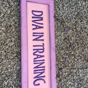 Diva in training sign